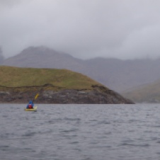 Jamie kayaking toward Garbh Chioch Mhor